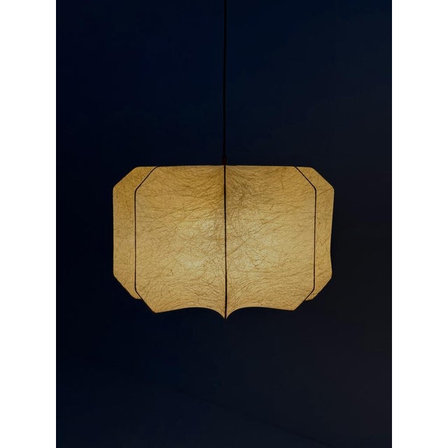 This special Cocoon pendant lamp , attributed to Achille and Pier Giacomo Castiglioni , is an iconic example of...