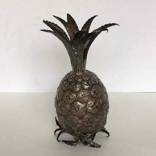 The miniature pineapple well cast and plated in silver, with a leaf-form lower section serving as a stand. This is not...