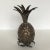 The miniature pineapple well cast and plated in silver, with a leaf-form lower section serving as a stand. This is not...