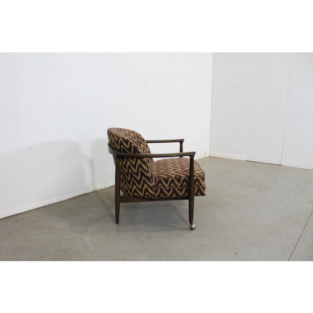 Mid-Century Danish Modern Barrel Back Club Chair Offered is a vintage mid-century Danish modern chair by Selig. It is...