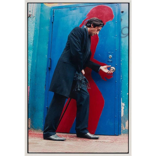 A large, framed color photograph entitled "The Blue Door" by Sylvia Plachy (American/Hungarian, b. 1943) created in 2008....