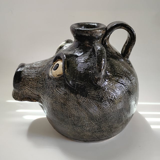 This piece is a Steve Turpin folk art bear face jug, a signature creation from the well-known Southern folk artist....