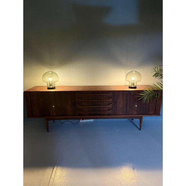 Exceptional set of two iconic mushroom table lamps by Peill & Putzler, executed in warm smoked glass, Germany, circa 1970....