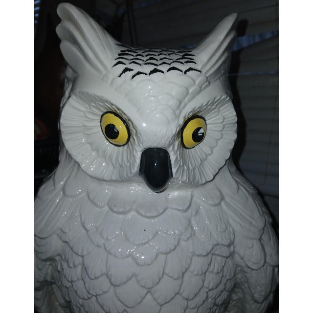70s Hollywood Regency style ceramic owl with high-gloss white glaze, contrasting, vibrant yellow hand-painted eyes, black...