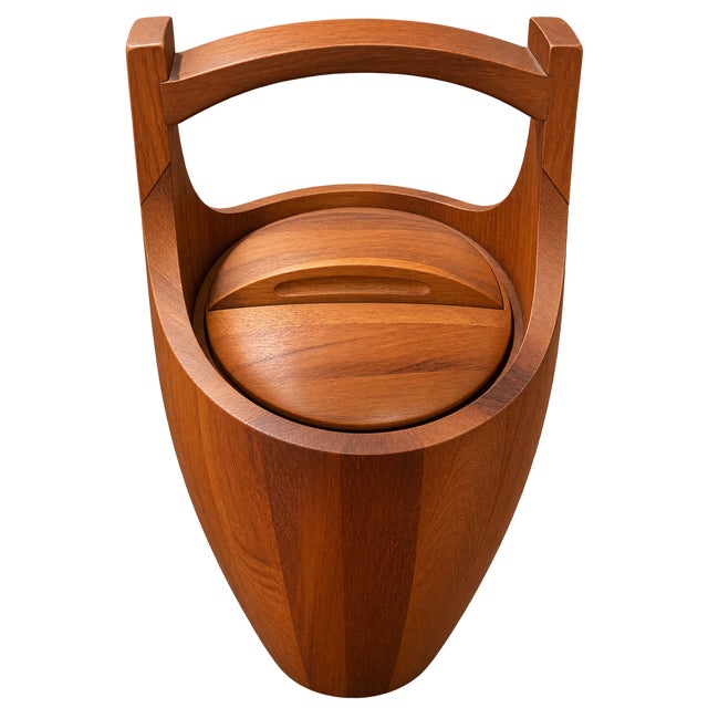Staved teak ice bucket designed by Jens Quistgaard for Dansk. Marked on the underside: Dansk logo / DANMARK / IHQ....