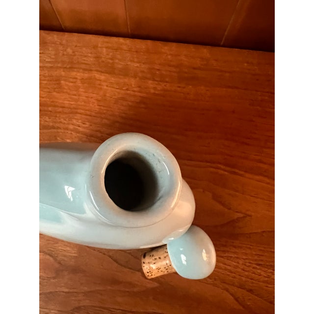 Vintage stoneware glazed wine carafe with cork stopper. The glaze is a light aqua and is in perfect shape. Marked on...