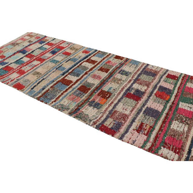 Hand-knotted in wool and circa 1950-1960, this vintage 5x10 Moroccan rug is believed to hail from the Azilal tribe. On the...