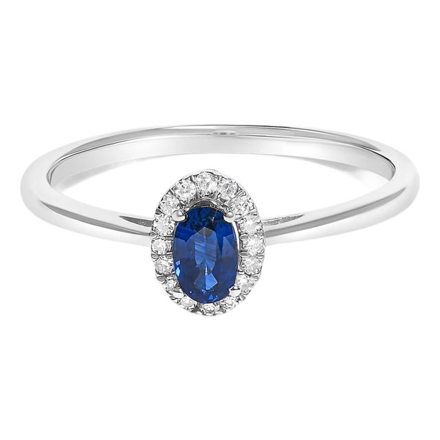 10K White Gold 5X3MM Oval Blue Sapphire and Diamond Accent Halo Ring (I-J Color, I1-I2 Clarity) - Ring Size 8 For Sale