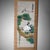 A beautiful Japanese bamboo blinds scroll featuring an elegant scene of cranes and pine trees, symbols of good fortune and...