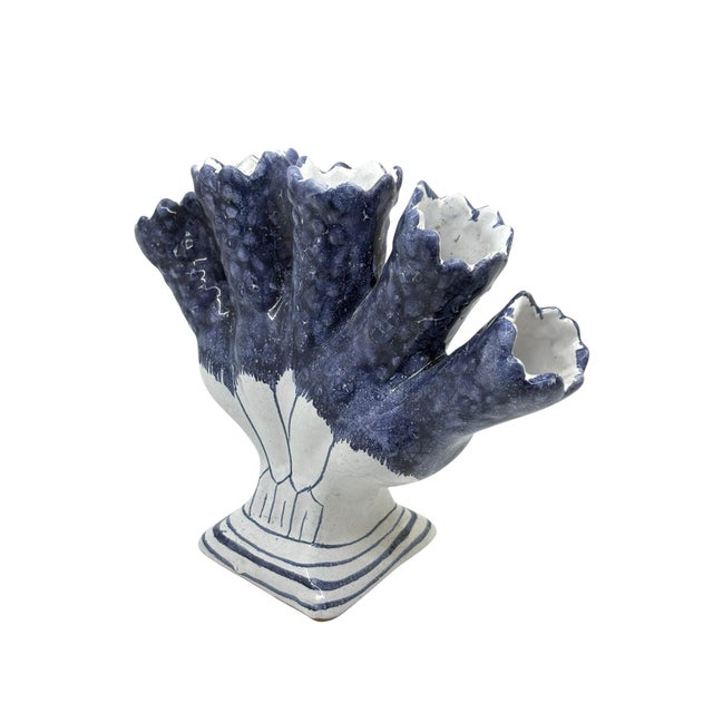 Vintage five finger tulip vase made in Portugal. The piece is signed underside Hand made pottery with blue and white...