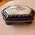 This vintage hand-painted porcelain extra large jewelry box is of French origin. The design characteristics—cobalt blue...