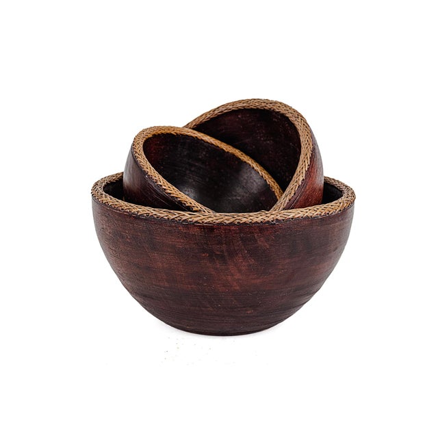 Vintage Indonesian Handmade Nesting Wooden Bowls. Typically associated with Southeast Asian or African artisan traditions....