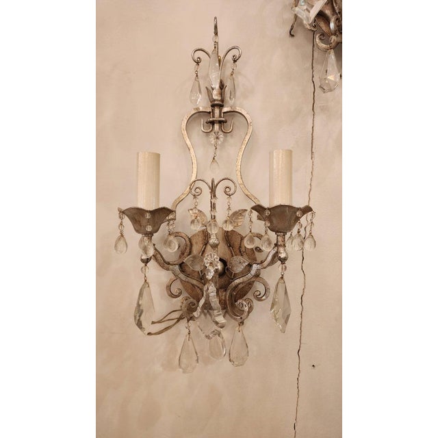 This listing features a pair of elegant metal and glass sconces each with two lights. The style these sconces are inspired...