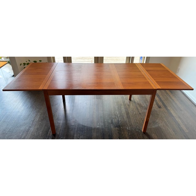 An exceptional Danish Modern teak extension dining table made by Vejle Stole og Møbelfabrik. Boasting a large footprint,...
