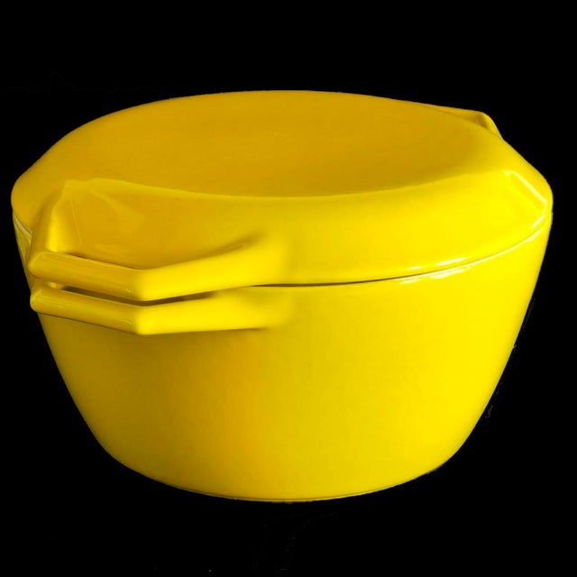 Offered is a quintessential mid 20th century D2 Dutch Oven and lid designed by Michael Lax for Copco in the 1960s. This...