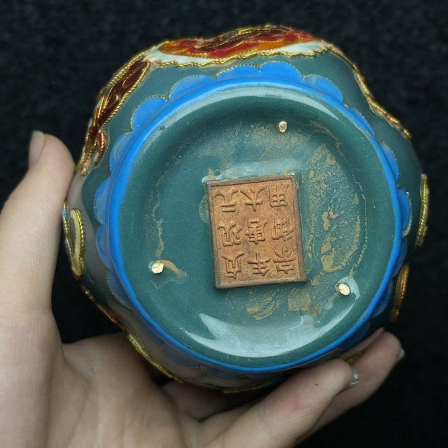 This is a charming and decorative vintage Chinese cloisonné vase. The piece features a smooth, soft turquoise-green enamel...