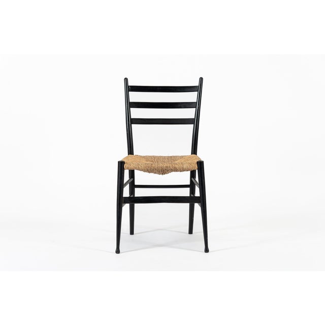 This vintage mid century modern side chair made in Italy circa 1960 is in the style of the Leggera chair by renowned mid...