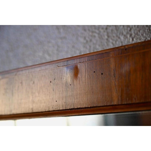 This is a large antique mirror, as simple as it is elegant. In the Louis Philippe style, the frame is made of elegant...