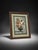Classic framed floral bouquet artwork featuring a decorative flower arrangement in a dark vase with warm vintage-style...