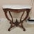 A lovely Victorian beveled marble turtle top table with white marble having gray veining. Base is either walnut or mahogany.