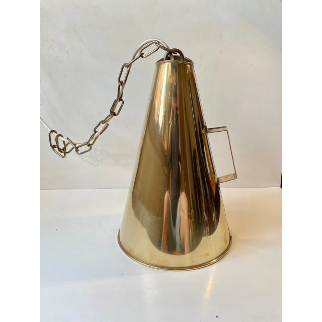 Old stylish yachtsmans megaphone in solid brass converted in to a chain-suspended ceiling lamp during the 1960s. Probably...