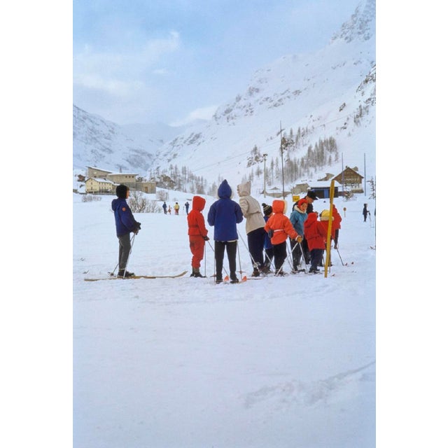 Val D’Isere by Toni Frissell A family enjoy winter skiing at Val d'Isere ski resort in France 1959. (Toni Frissell)...