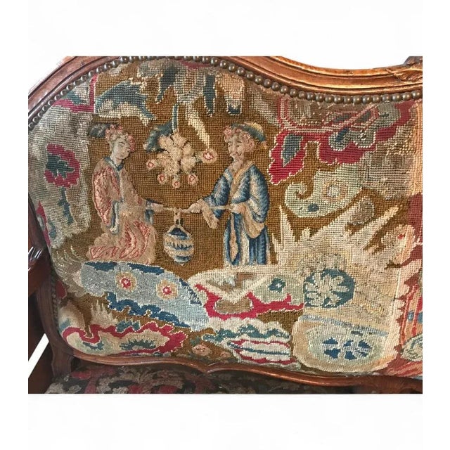 This exquisite Baroque sofa from Germany, circa 1750, features a finely hand-carved walnut frame with intricate details...