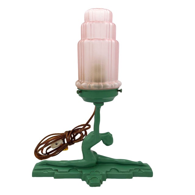 This Frankart sculptural table lamp features a beautiful nude woman doing a split on a stepped base, holding a 3" lamp...