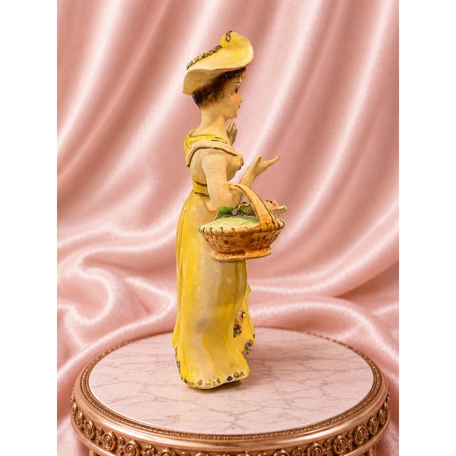 Elegant vintage Made in Japan porcelain lady figurine, dating approximately to the 1950s–early 1960s. She wears a dramatic...