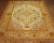 Excellent condition antique Turkish Oushak rug circa 1900-1910. Ivory ground with predominant accents in bright pink and...