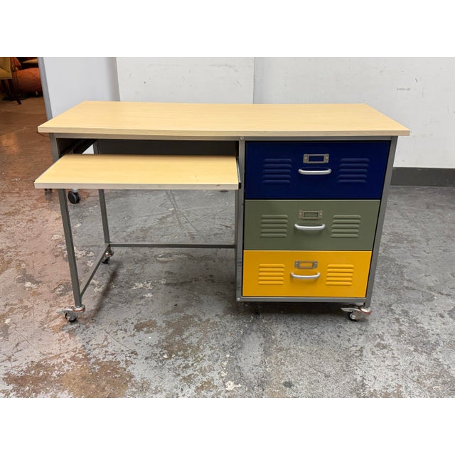 Design Plus Gallery presents the Teen Locker Desk from Pottery Barn. It has a durable metal frame with a natural wood top...