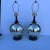 A stunning pair of C1950-60 mercuy glass/ round lamps resting on black bases. These are such great lamps that will fit...