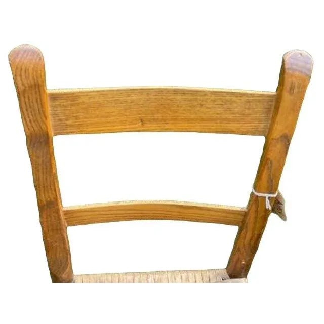 A beautiful early 20th century pair of oak ladderback chairs in Shaker style. Exact age unknown, but they are old, with a...