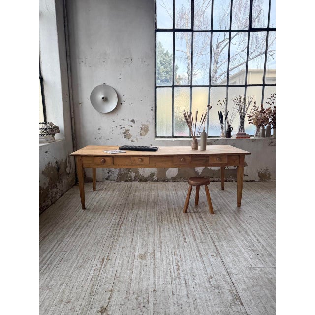 Vintage 1950s farmhouse table in solid pine, the kind used for communal dining. we love its size; it's very comfortable...