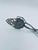 Vintage-style cake tongs from the 1970s, crafted from silver-colored metal. These scissor-shaped tongs are adorned with...