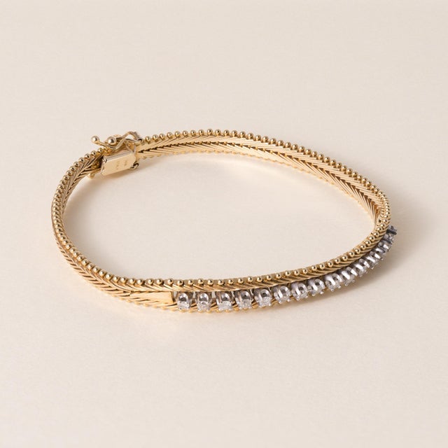 Vintage Diamond Flexible Bracelet in 14K Gold Circa 1980s This elegant vintage bracelet from the 1980s features a graceful...