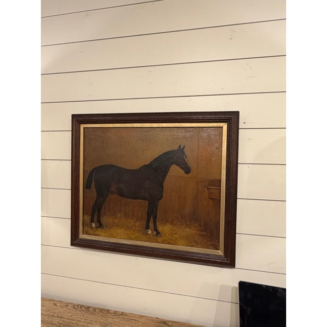 Charming vintage equestrian oil painting depicting a horse standing in a stable courtyard, rich with warm tones and rustic...