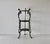 Vintage Victorian-style ornate cast iron three-tier plant stand featuring decorative openwork round shelves and sculptural...
