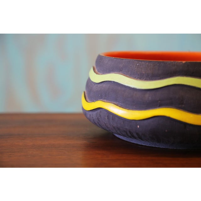 A large ceramic bowl produced by SICA c. 1950s italy. Featuring lime green and yellow freeform glazes over a raw ceramic...