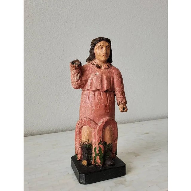An antique Spanish Colonial period hand carved and painted santo church altar figure. Born in Mexico in the first half of...