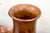 A pair of turned walnut footed vases or drinking vessels with beautiful patina, circular bases, thin pedestals and bell-...