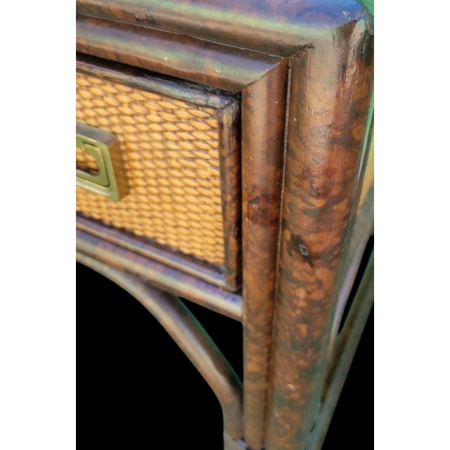 A beautiful vintage tortoiseshell and cane 2 drawer writing desk. The desk features pretty tortoiseshell surround with...