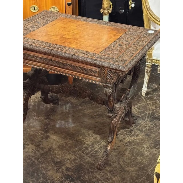 19th century Anglo Indian heavily carved oak one drawer writing table. Circa 1880. A timeless and classic touch for a fine...