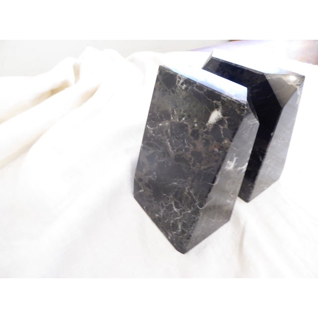 Pair of polished black marble bookends with veining, 6"H x 4"W x 3"D