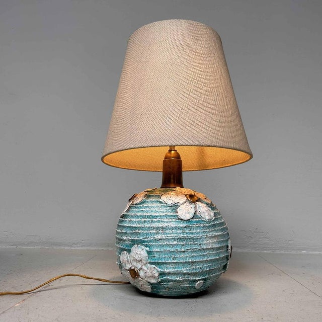 Timeless ceramic ambiance lamp from Italy, dating back to the '50s-'60s. Beautifully designed turquoise base with a floral...