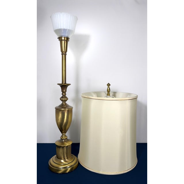 This is a collector-grade offering of a fully complete Stiffel neoclassical torchiere. While the weighted brass bases are...