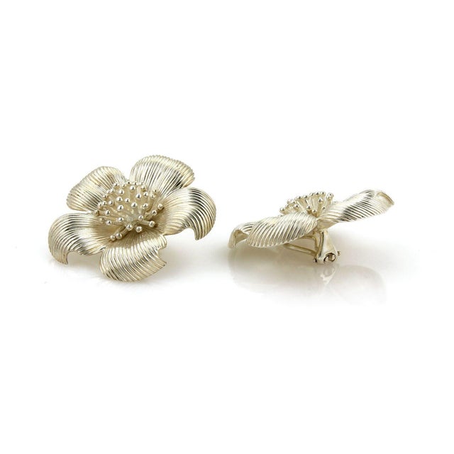 This is a stunning vintage pair earrings by Tiffany & Co. from the DOGWOOD collection. They are crafted from solid...
