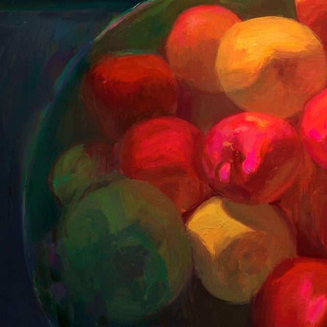 This oil on panel work features a vibrant arrangement of apples in a bowl, showcasing a rich palette of reds, yellows, and...