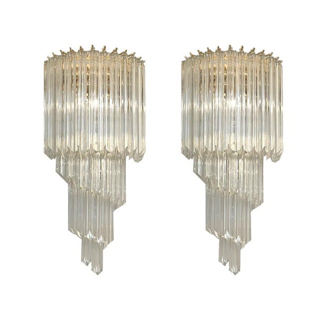 Pair of wall lamps from Venini Mid-Century Italy around 1960. Spirally arranged wall lamps, each with 28 glass rods in...