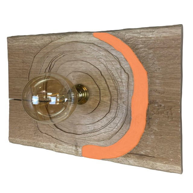 "Trottola Arancio" lamp by Pietro Meccani, 1996. Beautiful wall lamp in carved oak wood with orange painted parts. In the...